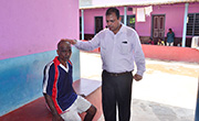 Pastor Sunil John D'souza Praying for health and wealth for new inmate of Amara Vishwasada Mane