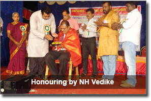 Honouring by Pramod Madwaraj, MLA Udupi - Nagarika Hitarakshana Vedike Kodankur Udupi on 19th May 2013.